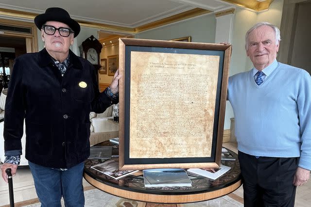 <p>Simon Perry</p> Billy Mumford, left, and his copy of Jefferson's Declaration of Independence, with author Jeffrey Archer in London Sept. 2024