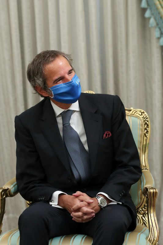 International Atomic Energy Agency (IAEA) Director General Rafael Grossi wears a mask during his meeting with Iranian President Hassan Rouhani in Tehran