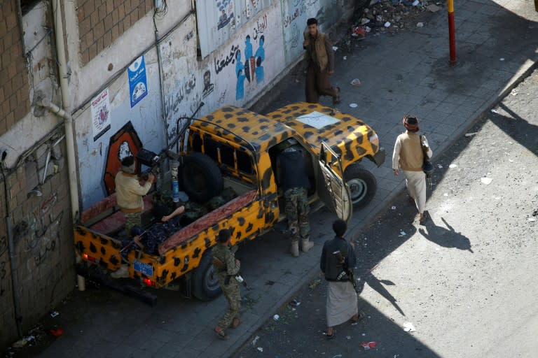 Huthi fighters patrol a street in the Yemeni capital Sanaa on December 3, 2017, during clashes with supporters of Yemeni ex-president Ali Abdullah Saleh