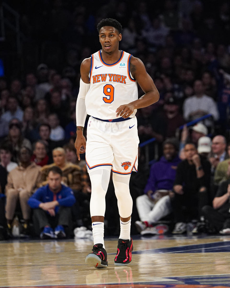 New York Knicks guard RJ Barrett jogs back on defense after hitting a three-pointer during the first half of an NBA basketball game against the Toronto Raptors in New York, Monday, Dec. 11, 2023. (AP Photo/Peter K. Afriyie)