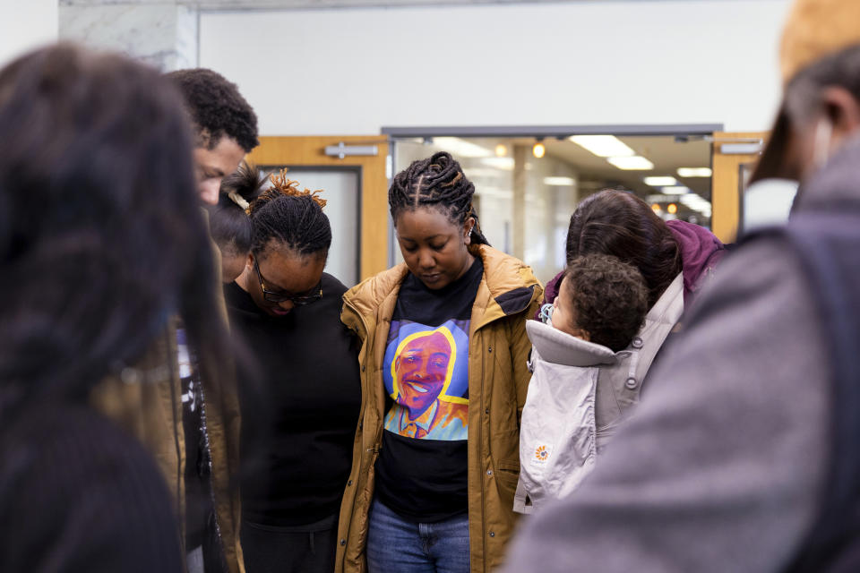 Members of Manny Ellis' family gather before the verdicts were read during the trial of three Tacoma (Wash.) police officers in the 2020 death of Ellis, at Pierce County Superior Court on Thursday, Dec. 21, 2023, in Tacoma. A jury cleared the three police officers of all criminal charges. (AP Photo/Maddy Grassy)