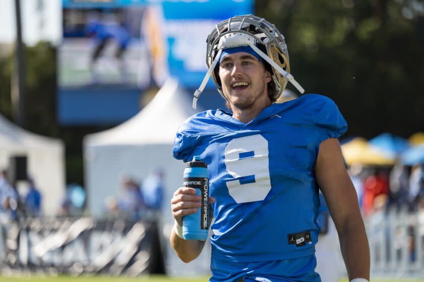 Los Angeles, CA - April 23: UCLA wide receiver Jake Bobo hydrates during Spring Showcase.