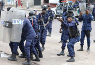 FILE PHOTO: Policemen react after a protester threw a stone from Notre Dame Cathedral compound in Kinshasa, Democratic Republic of Congo, February 25, 2018. REUTERS/Goran Tomasevic/File Photo