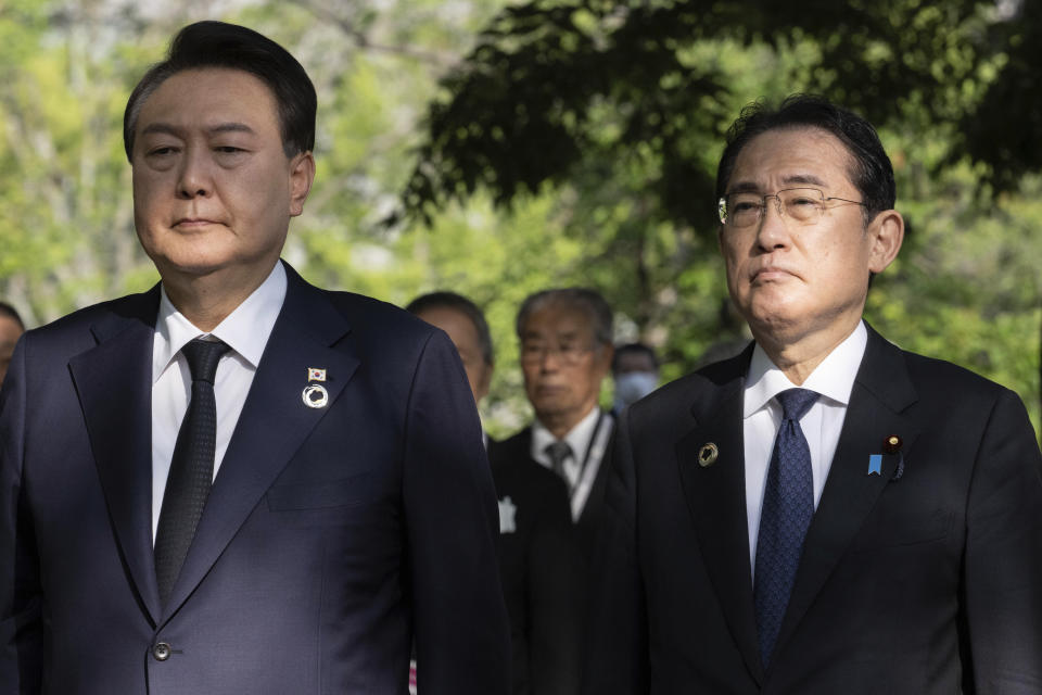 South Korea's President Yoon Suk Yeol, left, and Japan's Prime Minister Fumio Kishida, right, visit the "Monument in Memory of the Korean Victims of the A-bomb", near the Peace Park Memorial in Hiroshima Sunday, May 21, 2023, on the sidelines of the G7 Summit Leaders' Meeting. (Yuichi Yamazaki/Pool Photo via AP)