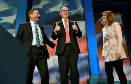 Representative Kevin Cramer (R-ND) with his wife Kris and state GOP chairman Rick Berg (L) attend the 2018 North Dakota Republican Party Convention in Grand Forks, North Dakota, U.S. April 7, 2018. The party endorsed Cramer for the U.S. Senate race against Democratic Sen. Heidi Heitkamp. REUTERS/Dan Koeck