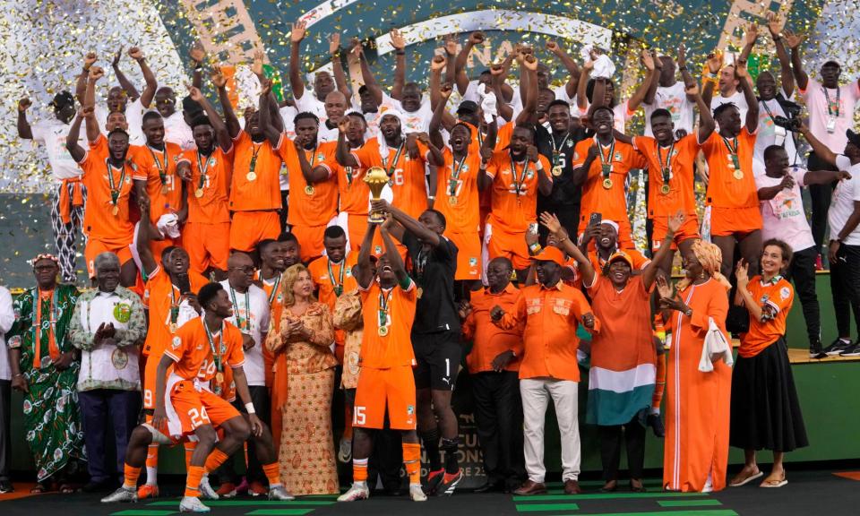 <span>Ivory Coast’s Max-Alain Gradel lifts the trophy after winning the Africa Cup of Nations final against Nigeria.</span><span>Photograph: Sunday Alamba/AP</span>