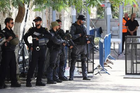 Israeli police officers stand guard next to recently installed metal detectors at an entrance to the compound known to Muslims as Noble Sanctuary and to Jews as Temple Mount in Jerusalem's Old City July 23, 2017. REUTERS/Ammar Awad