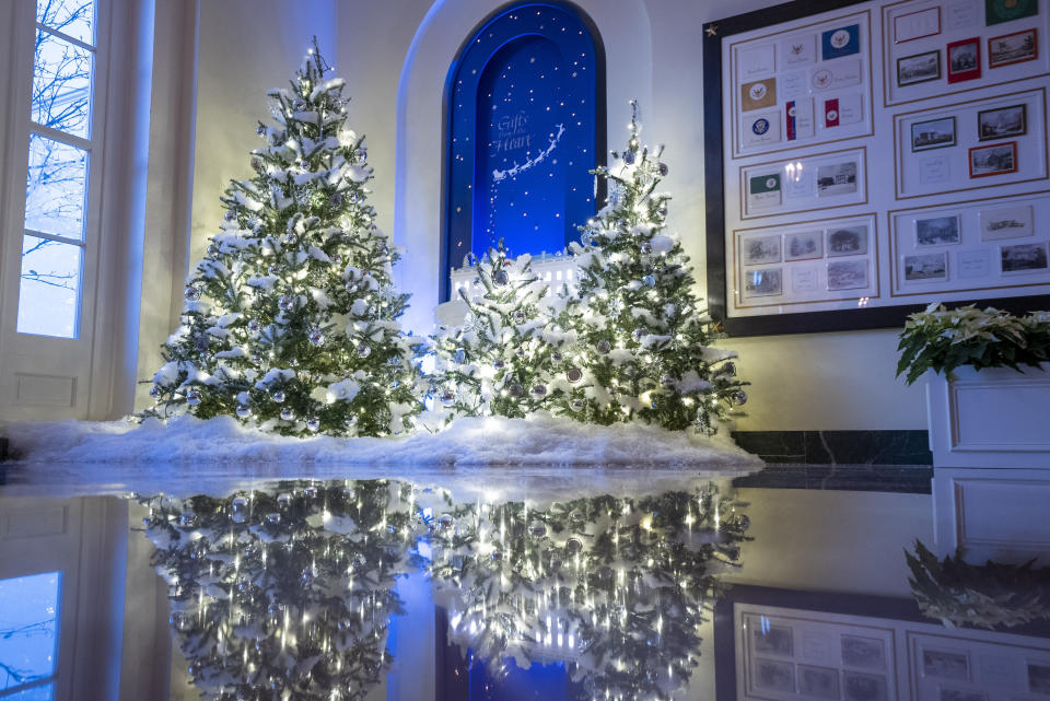 Christmas trees are decorated in the Booksellers Hall of the White House on November 29, 2021 in Washington DC. This year’s theme for the White House Christmas decorations is ÒGifts from the Heart.Ó Photo by Ken Cedeno/Sipa USA.(Sipa via AP Images) - Credit: Sipa USA via AP