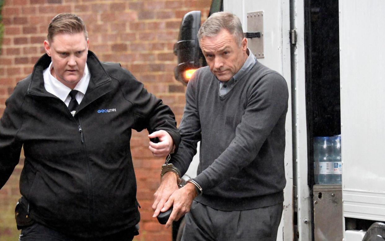 Stephen Beagley pictured in handcuffs in 2019, when he was first jailed for child sexual abuse - Brighton Pictures