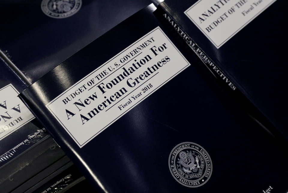 Copies of the budget are distributed on Capitol Hill in Washington