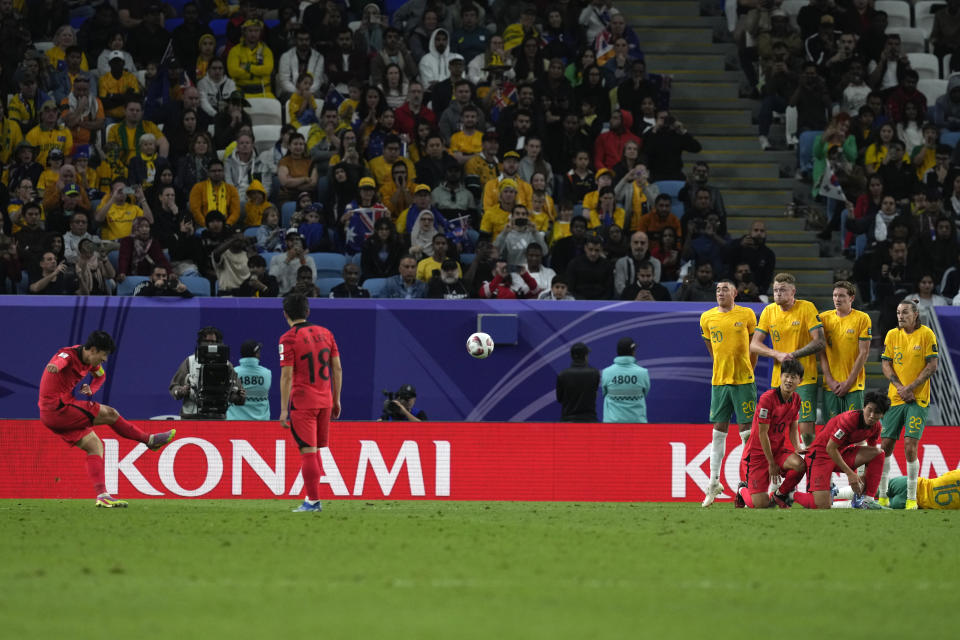 South Korea's Son Heung-min, left, scores his team's second goal in a free kick during the Asian Cup quarterfinal soccer match between Australia and South Korea at Al Janoub Stadium in Al Wakrah, Qatar, Friday, Feb. 2, 2024. (AP Photo/Thanassis Stavrakis)