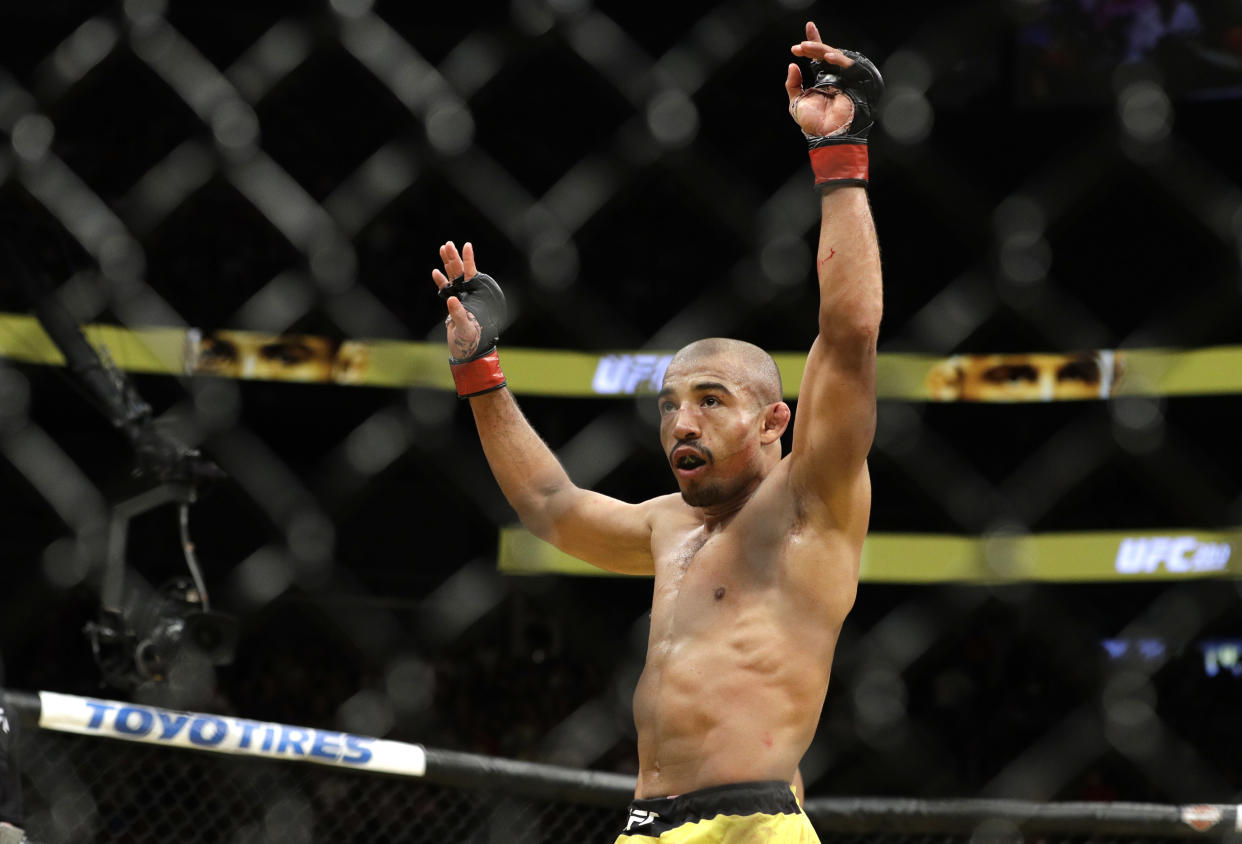 Jose Aldo celebrates after defeating Frankie Edgar during their featherweight championship mixed martial arts bout at UFC 200, Saturday, July 9, 2016, in Las Vegas. (AP Photo/John Locher)