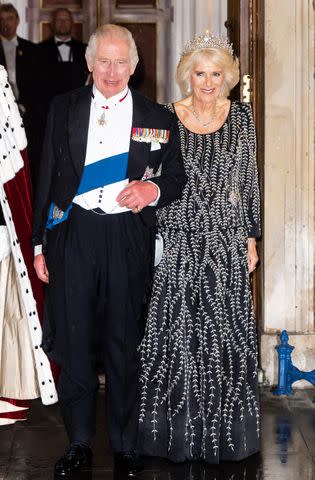 <p>Samir Hussein/WireImage</p> King Charles and Queen Camilla attend coronation dinner on Oct. 18, 2023