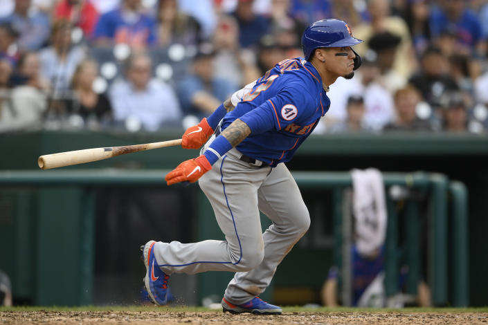 FILE - New York Mets' Javier Baez bats during a baseball game against the Washington Nationals, Sunday, Sept. 5, 2021, in Washington. Javier Baez is nearing a $140 million, six-year contract with Detroit, giving the Tigers a dynamic bat for the middle of their order. Baez, who turns 29 on Wednesday, hit .265 with 31 homers and 87 RBIs in 138 games with the Cubs and Mets last season. A person with direct knowledge of the situation confirmed the deal to The Associated Press on Tuesday, Nov. 30, on condition of anonymity because the contract had not been finalized. (AP Photo/Nick Wass, File)