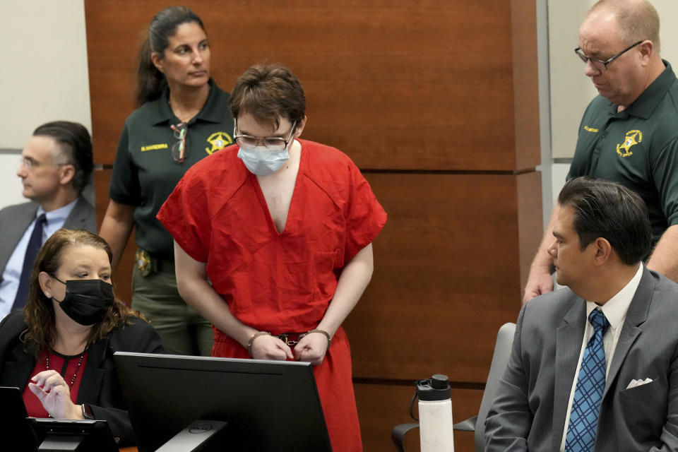 Marjory Stoneman Douglas High School shooter Nikolas Cruz is escorted into the courtroom for a hearing regarding possible jury misconduct during deliberations in the penalty phase of his trial, Friday, Oct. 14, 2022, at the Broward County Courthouse in Fort Lauderdale, Fla. (Amy Beth Bennett/South Florida Sun Sentinel via AP, Pool)