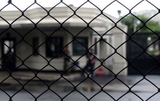 Philippine police secure the entrance to the US embassy compound known as 'Seafront' in Pasay, a major district of Manila. Britain, Canada and Australia have joined the US in issuing a security alert for their citizens in the Philippines after the US embassy warned of a threat against Americans in the capital