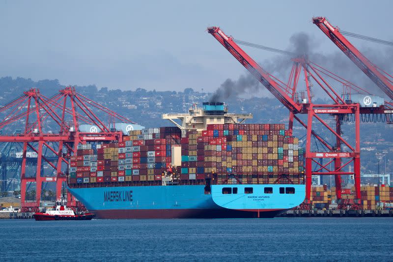 A Maersk Line container ship prepares to depart port in Long Beach, California