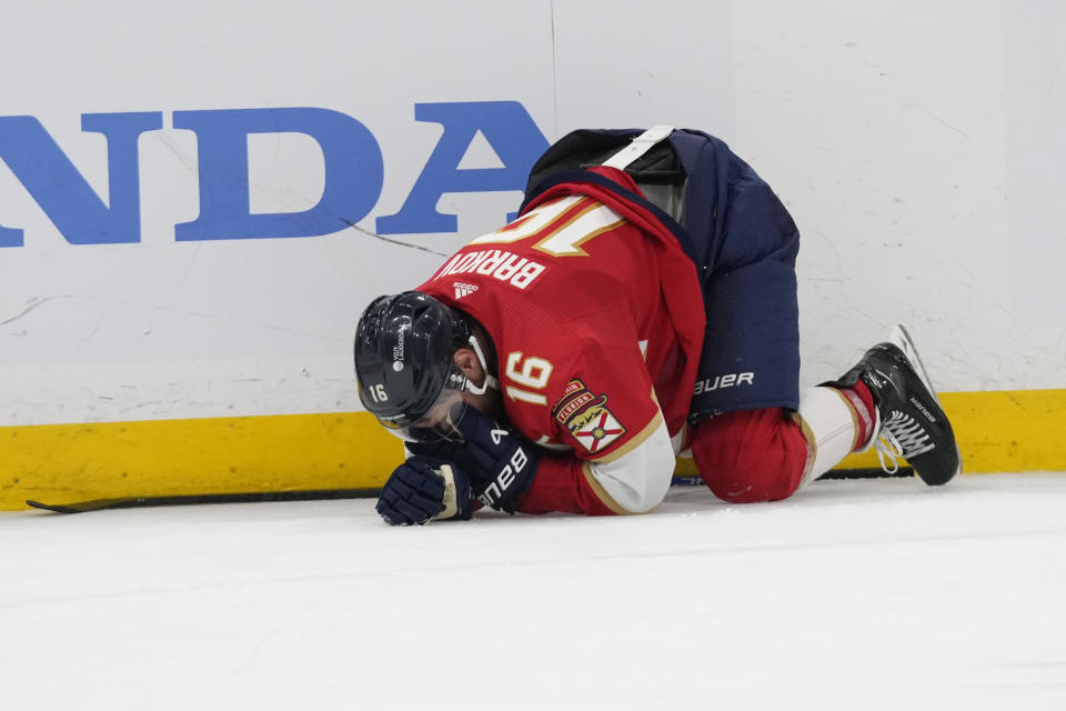 Florida Panthers center Aleksander Barkov (16) kneels on the ice after he was injured during the third period of Game 2 of the NHL hockey Stanley Cup Finals against the Edmonton Oilers, Monday, June 10, 2024, in Sunrise, Fla. (AP Photo/Wilfredo Lee)