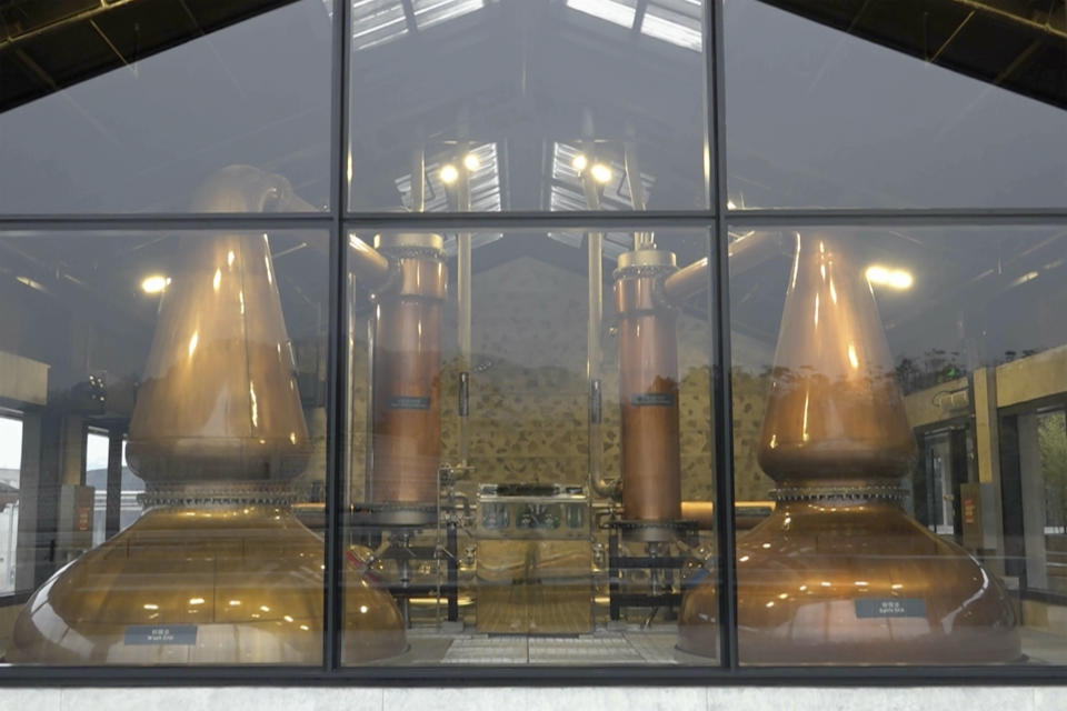 This image from a video, shows a view of the distilling facilities at The Chuan Malt Distillery is seen in Emeishan in southwestern China's Sichuan province on Dec. 13, 2023. The more than $100 million distillery owned by Pernod Ricard and based at the UNESCO World Heritage site Mount Emei, launched a pure-malt whisky, The Chuan, aiming to tap a growing taste among young Chinese for whisky in place of the traditional "baijiu" used to toast festive occasions. (AP Photo/Caroline Chen)