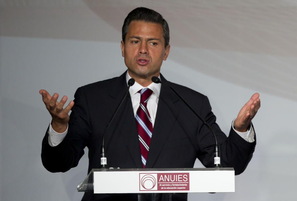 Enrique Pena Nieto, presidential candidate for the Institutional Revolutionary Party (PRI), speaks during a meeting with Mexican universities rectors in Mexico, Monday, May 21, 2012. Pena Nieto, the front-running candidate in the race for Mexico's July 1 presidential election, is pledging to respect transparency and plurality if elected, things his Institutional Revolutionary Party was not known for during 71 years in power. (AP Photo/Eduardo Verdugo)