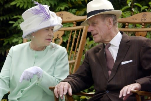 Britain's Queen Elizabeth II and Prince Philip, who is undergoing hospital treatment for what Buckingham Palace described as a "pre-existing condition"