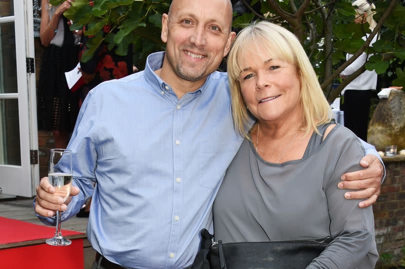 LONDON, ENGLAND - SEPTEMBER 04:  Mark Dunford (L) and Linda Robson attend Kelly Simpkin London's fashion soiree garden party in support of the British Red Cross at the home of Kelly Simpkin and Nicky Clarke on September 4, 2015 in London, England.  (Photo by David M. Benett/Dave Benett/Getty Images)