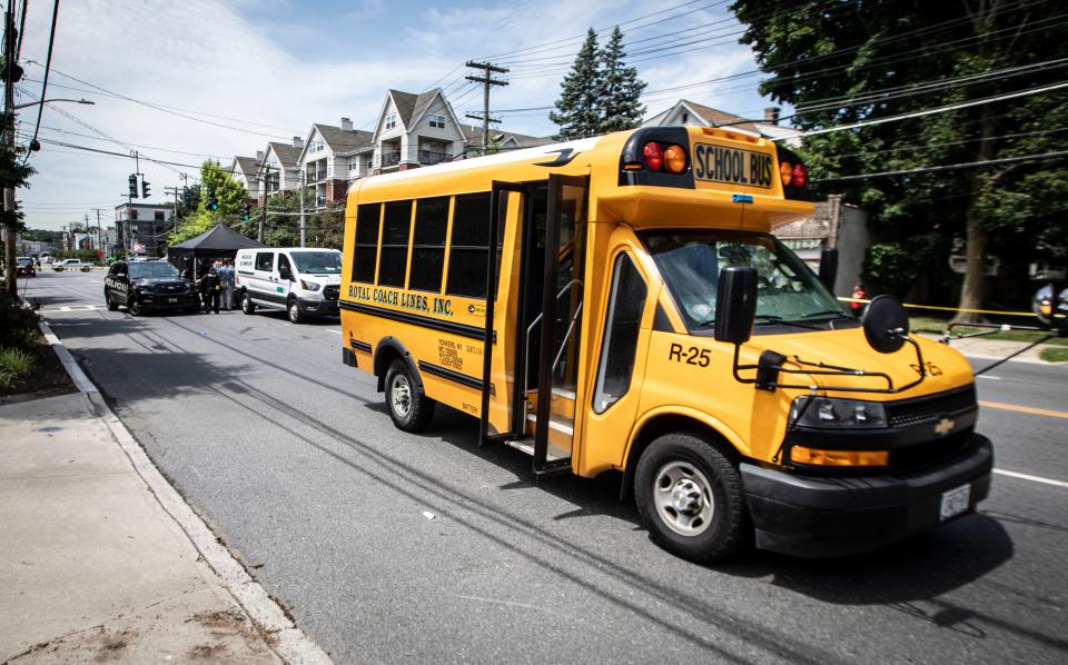 Police, along with the Westchester County Medical Examiner's office at the scene of an accident on Mamaroneck Ave. in Mamaroneck where a child and his mother were struck and killed by a school bus June 20, 2024.