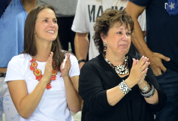 Debbie Phelps (R), mother of U.S. swimmer Michael Phelps cries during the podium ceremony of the men's 4x200m freestyle relay final during the swimming event at the London 2012 Olympic Games on July 31, 2012. | AFP—Getty Images