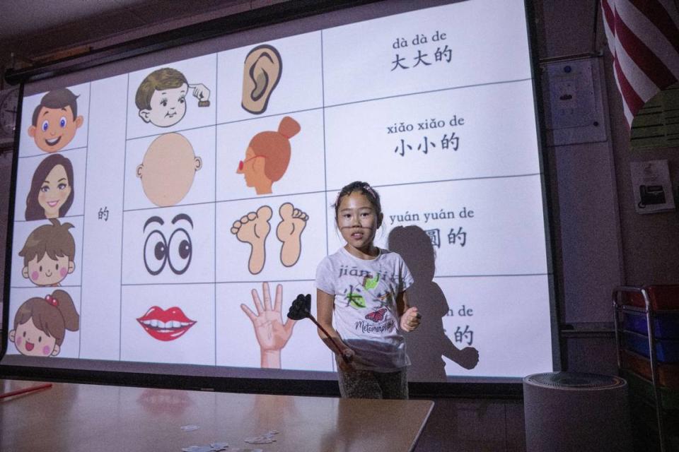 Bella Yu, 9, pronounces the Mandarin words for body parts on Tuesday, July 11, 2023, during a dual-language summer school program at William Land Elementary school in Southside Park. The school has is one of seven dual-language immersion programs in the Sacramento City Unified School District.