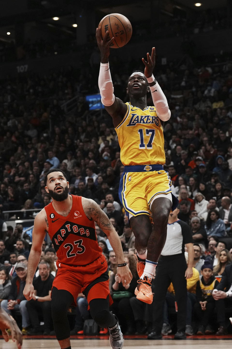 Los Angeles Lakers' Dennis Schroder shoots as Toronto Raptors' Fred VanVleet watches during the first half of an NBA basketball game Wednesday, Dec. 7, 2022, in Toronto. (Chris Young/The Canadian Press via AP)