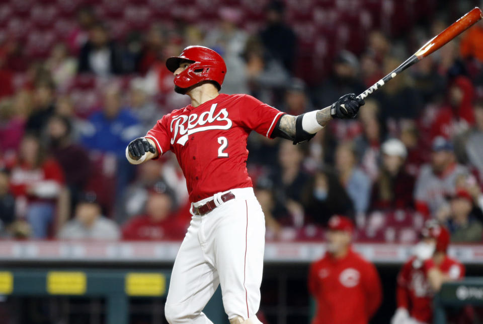 Cincinnati Reds' Nick Castellanos watches his solo home run in the bottom of the ninth inning against Washington Nationals pitcher Patrick Murphy to win a baseball game in Cincinnati, Saturday, Sept. 25, 2021. AP Photo/Paul Vernon)