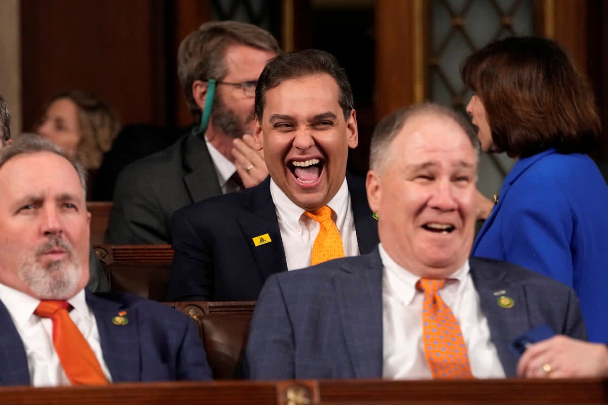 Rep. George Santos laughs before President Joe Biden delivers the State of the Union address (via REUTERS)