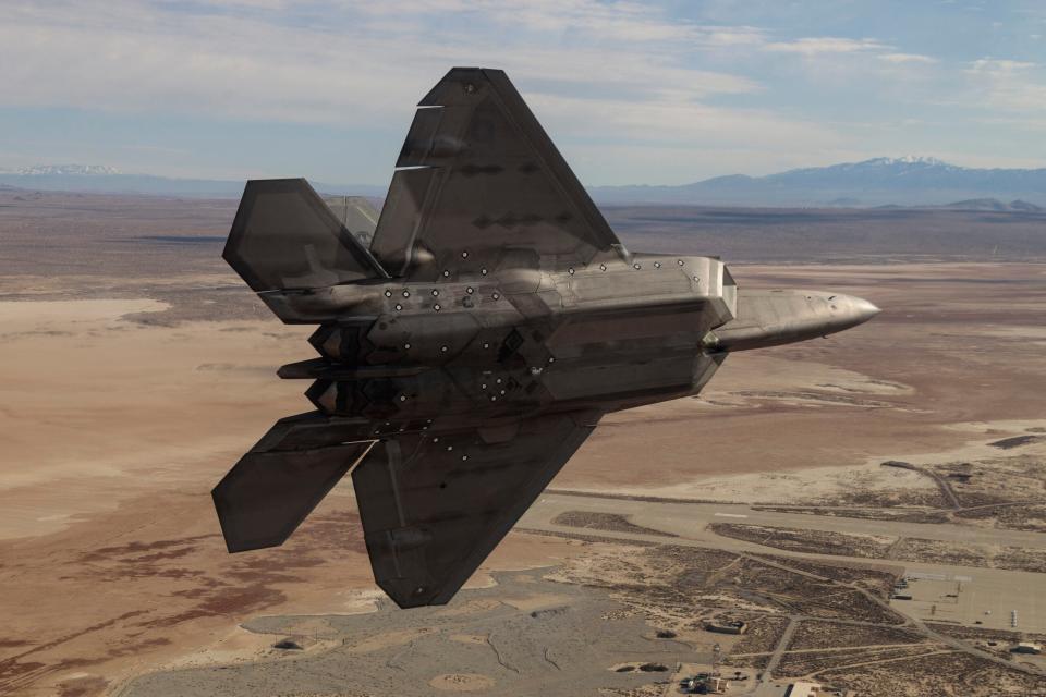 F-22 Raptors assigned to the 411th Flight Test Squadron, 412th Test Wing, out of Edwards Air Force Base, California, conduct a test sortie over the Pacific Ocean. <em>Photo courtesy of Kyle Larson/Lockheed Martin</em>