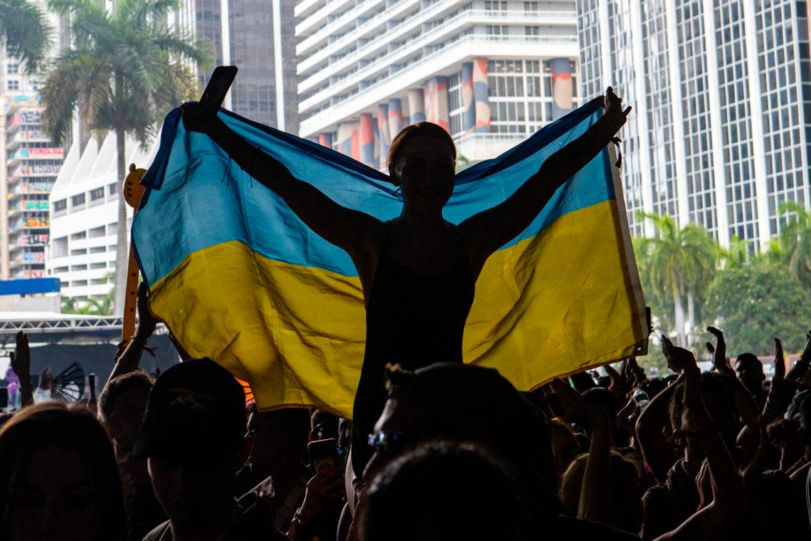 A festival goer holds up a Ukrainian flag during Day 2 of Ultra 2024 at Bayfront Park in Downtown Miami on Saturday, March 23, 2024.