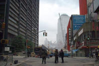 <p>The skeleton of one of the twin towers is seen as emergency personnel keep the area secure on Sept. 19, 2001. (Photo: Gordon Donovan/Yahoo News) </p>