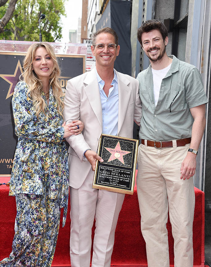 Grant Gustin, Kaley Cuoco and Greg Berlanti (center) at the star ceremony where Greg Berlanti is honored with a star on the Hollywood Walk of Fame in Los Angeles, California on May 23, 2022. - Credit: Gilbert Flores for Variety