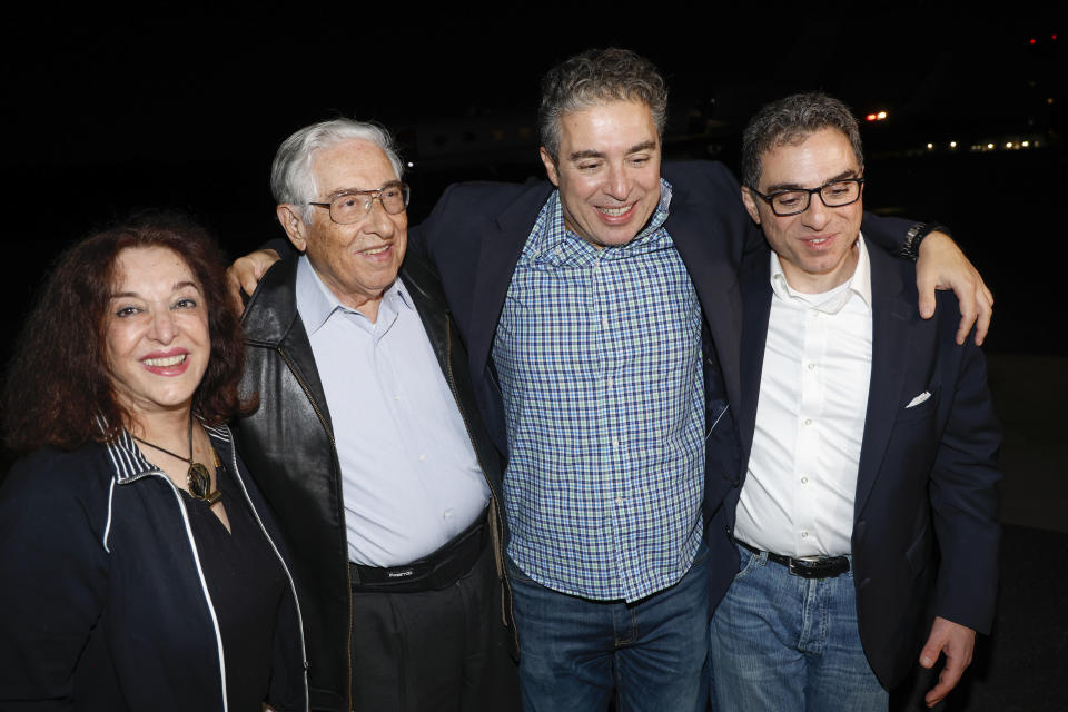 Family members greet freed Americans Siamak Namazi, Morad Tahbaz and Emad Shargi, as well as two returnees whose names have not yet been released by the U.S. government, who were released in a prisoner swap deal between U.S and Iran, as they arrive at Davison Army Airfield, Tuesday, Sept. 19, 2923 at Fort Belvoir, Va. (Jonathan Ernst/Pool via AP)