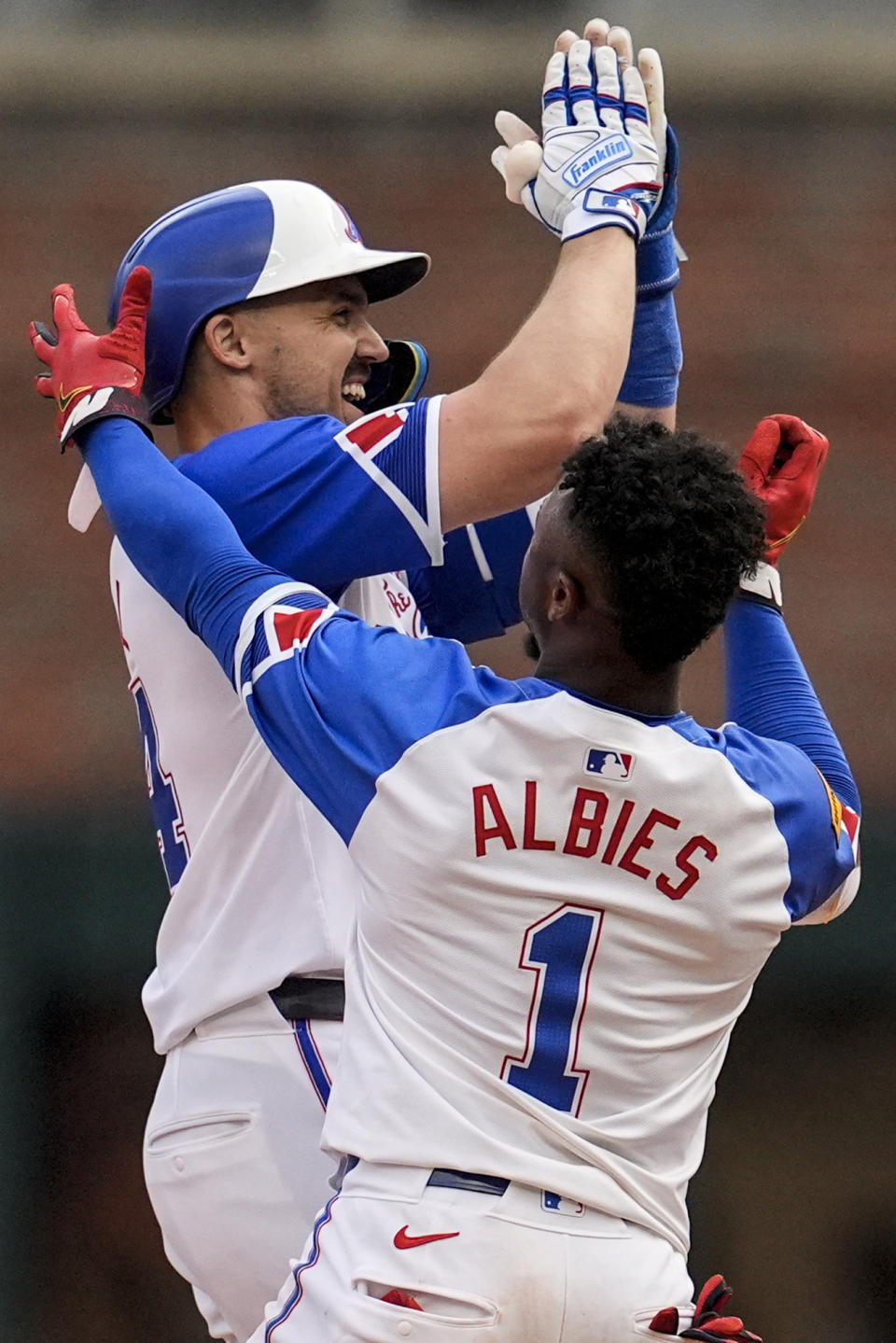 Atlanta Braves outfielder Adam Duvall (14) celebrates his game-winning RBI against the Pittsburgh Pirates in the 10th inning of a baseball game, Saturday, June 29, 2024, in Atlanta. (AP Photo/Mike Stewart)