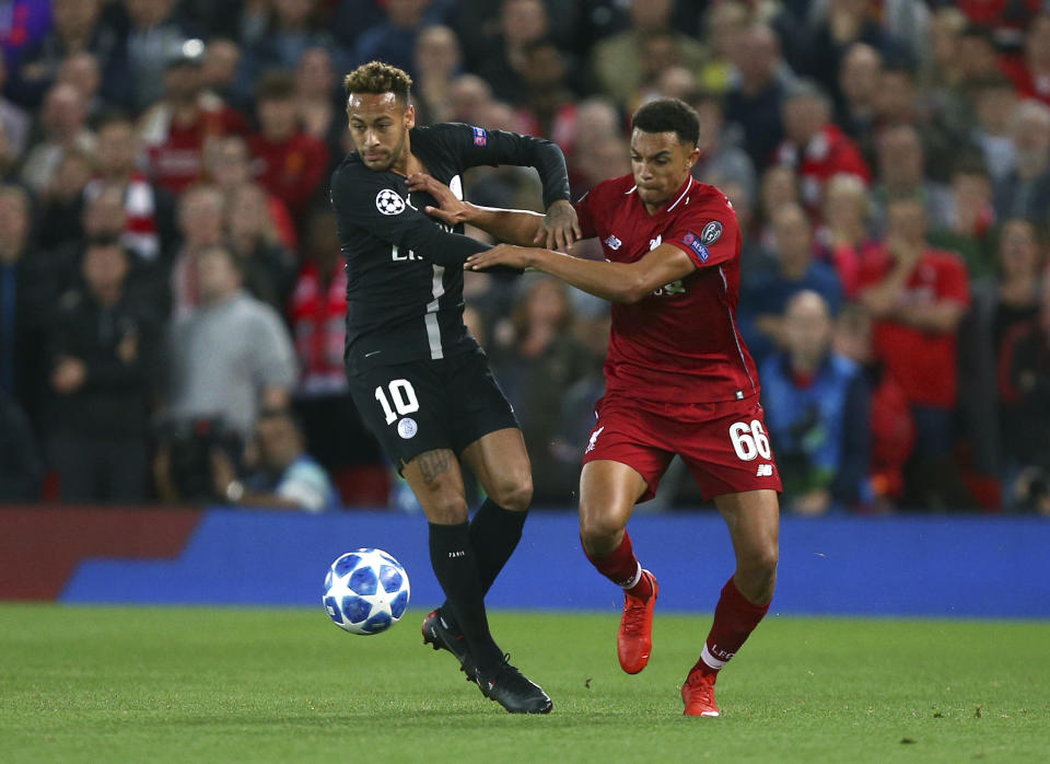 Liverpool's Trent Alexander-Arnold, right, competes for the ball with PSG's Neymar during the Champions League Group C soccer match between Liverpool and Paris-Saint-Germain at Anfield stadium in Liverpool, England, Tuesday, Sept. 18, 2018. (AP Photo/Dave Thompson)