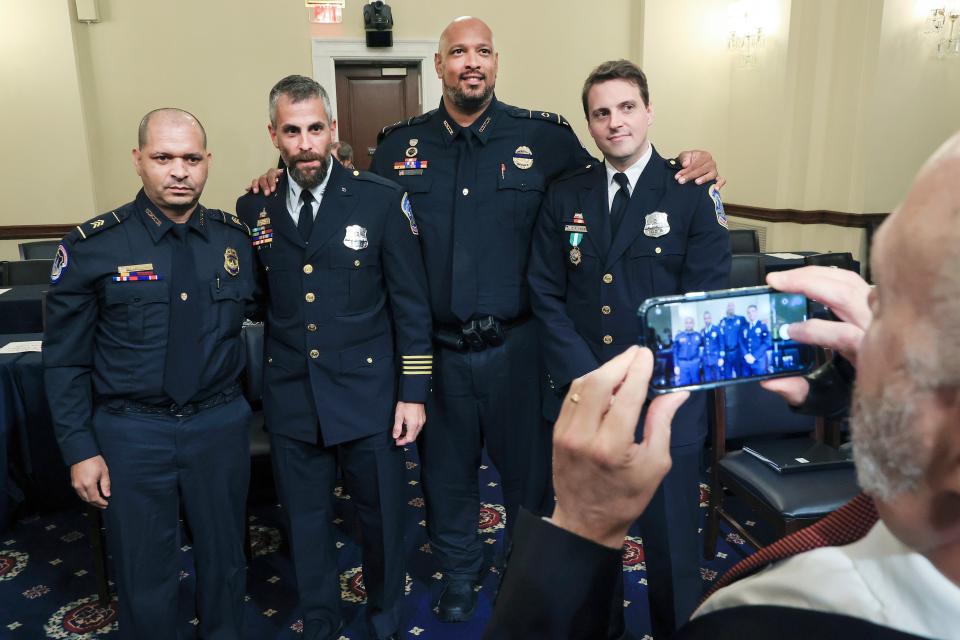 Sgt. Aquilino Gonell, from left, officer Michael Fanone, Sgt Harry Dunn and officer Daniel Hodges (AP)