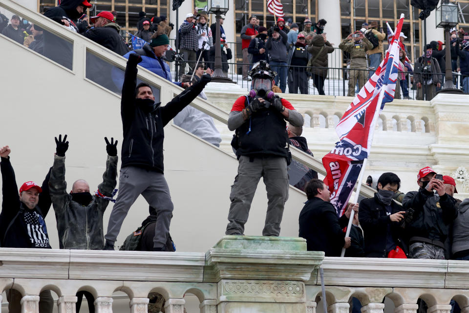 WASHINGTON, DC - JANUARY 06: Protesters gather on the U.S. Capitol Building on January 06, 2021 in Washington, DC. Pro-Trump protesters entered the U.S. Capitol building after mass demonstrations in the nation's capital during a joint session Congress to ratify President-elect Joe Biden's 306-232 Electoral College win over President Donald Trump. (Photo by Tasos Katopodis/Getty Images)