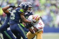 Sep 17, 2017; Seattle, WA, USA; Seattle Seahawks cornerback Richard Sherman (25) tackles San Francisco 49ers wide receiver Pierre Garcon (15) after a reception during the third quarter at CenturyLink Field. Joe Nicholson-USA TODAY Sports