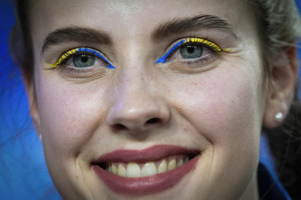 Silver medalist Yaroslava Mahuchikh of Ukraine wears eye makeup in her country's colors while competing in the women's high jump during the World Athletics Indoor Championships at the Emirates Arena in Glasgow, Scotland, Friday, March 1, 2024. (AP Photo/Bernat Armangue)