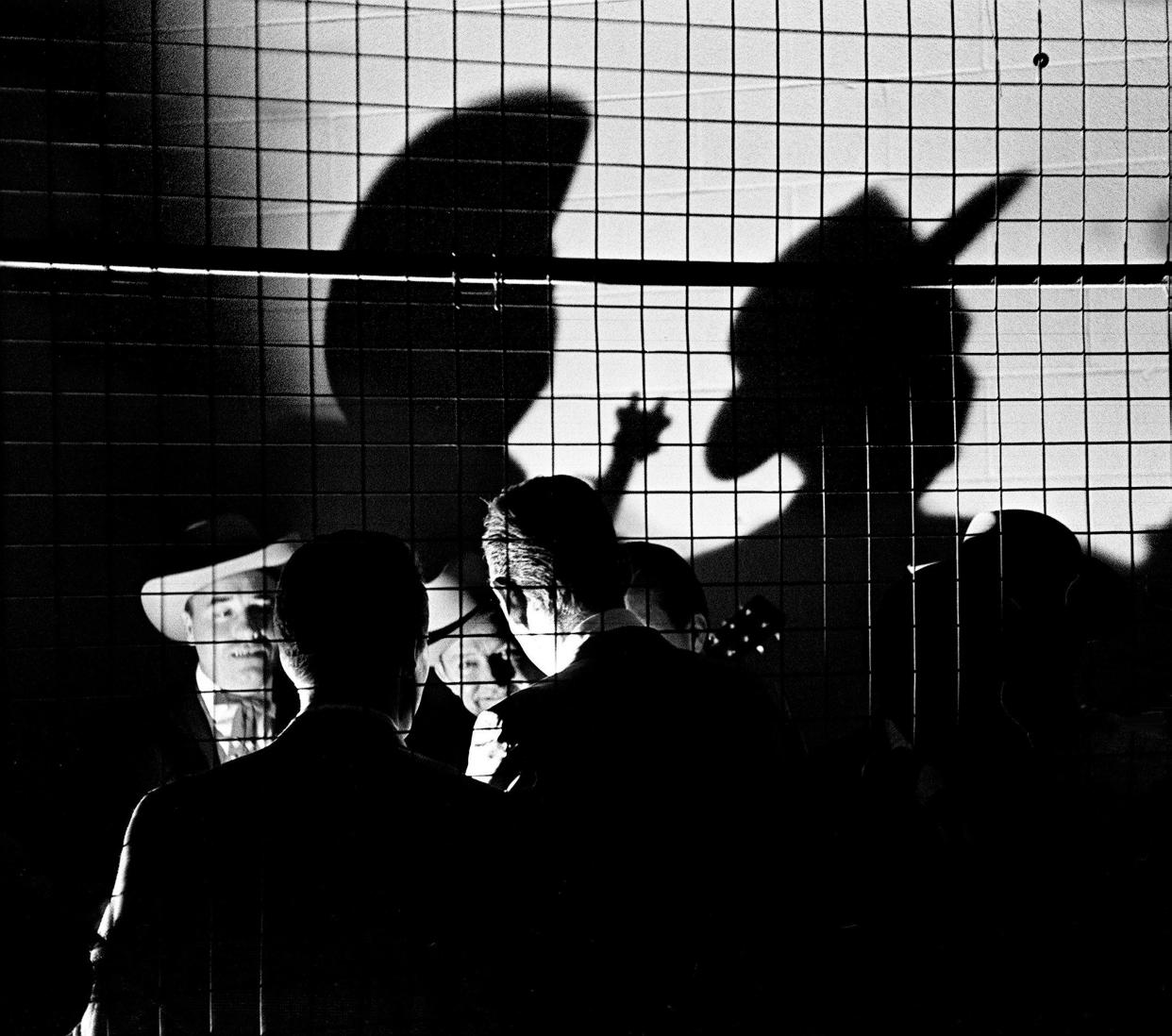 Earl Scruggs, left, and Lester Flatt waits back stage before performing at one of the show during the 12th annual Country Music Festival at Municipal Auditorium on Nov. 1, 1963.