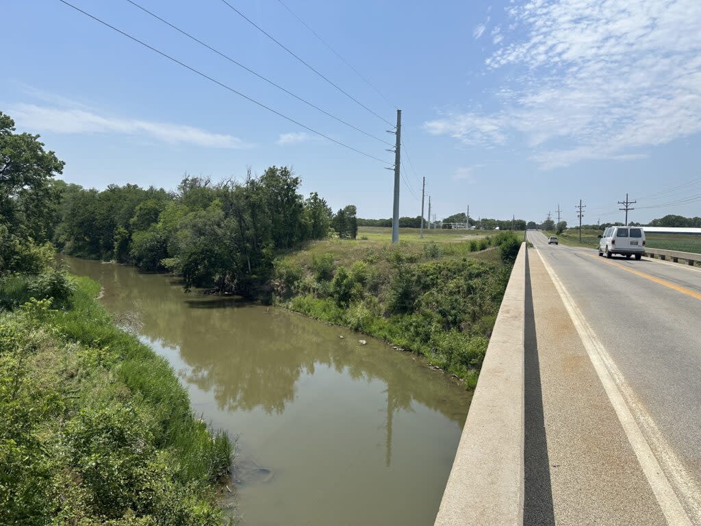 Cars drive across the East North Street bridge over the Smoky Hill River in Salina