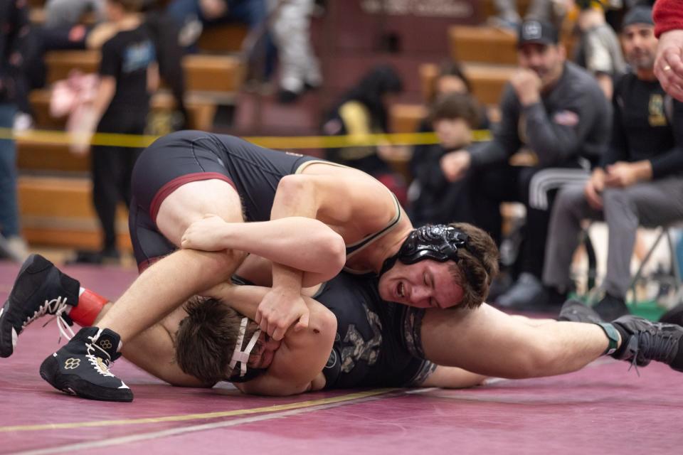 Arlington's Lucas Cardella, top wrestles Ward Melville's AJ Lollo, bottom at the 57th Mid-Hudson wrestling Tournament in LaGrange, NY on December 28, 2023.