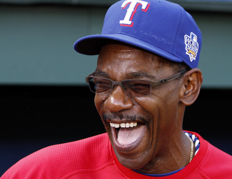 FILE - Texas Rangers manager Ron Washington laughs as his team warms up before Game 4 of baseball's World Series against the San Francisco Giants Sunday, Oct. 31, 2010, in Arlington, Texas. Ron Washington often reflects on his first managerial job, and taking the Texas Rangers to their first two World Series appearances. (AP Photo/Matt Slocum, File)