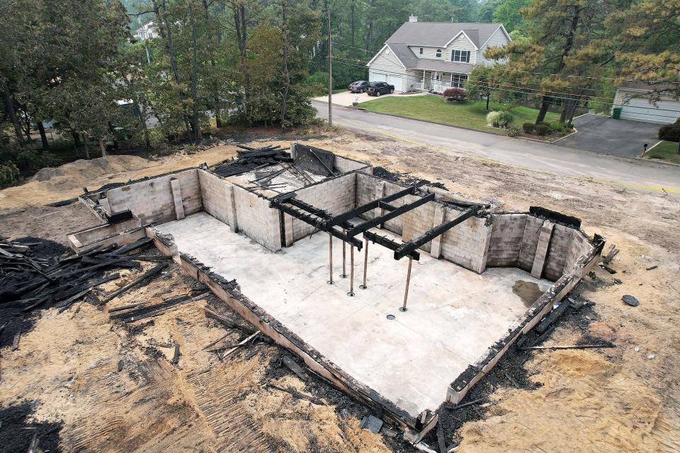 The remains of 1932 1st Avenue in Manchester is shown Thursday, June 8, 2023.  The home was gutted by a suspicious fire Wednesday.