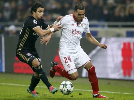 Football Soccer - Olympique Lyon v Sevilla - UEFA Champions League Group Stage - Group stage - Stade de Lyon - Decines, France - 7/12/16. Olympique Lyon's Rafael in action with Sevilla's Gabriel Mercado. REUTERS/Robert Pratta