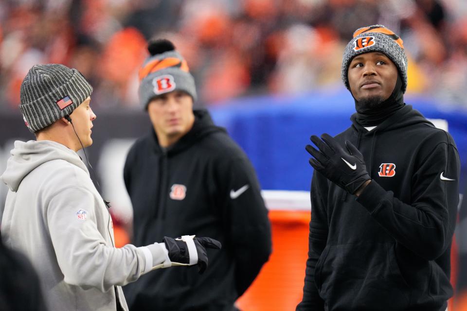 Injured Cincinnati Bengals quarterback Joe Burrow (9) talks with injured wide receiver Tee Higgins (5) on the sideline in the fourth quarter of the NFL Week 12 game between the Cincinnati Bengals and the Pittsburgh Steelers at Paycor Stadium in Cincinnati on Sunday, Nov. 26, 2023. The Steelers took a 16-10 win over the Bengals in Cincinnati.